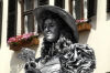 Austria - Innsbruck (Tirol / Tyrol): Young Lady in Innsbruck Capital of Austrian federal state of Tirol. She's clothed and colored al overall in silver earning her money as a stree artist (photo by W.Schmidt)