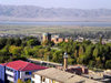 Nakhchivan city, Azerbaijan: city seen from a roof toop - minaret, mausoleum of Momine Khatun, Aras river and Iranian mountains in the distance - photo by K.Jafarli