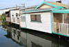 Belize City, Belize: houses hanging over the Southside Canal - West Canal St. - photo by M.Torres