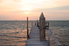 Belize - Caye Caulker: setting with the sun - pier and Caribbean Sea - photo by C.Palacio