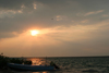 Belize - Seine Bight, Placencia peninsula, Stann Creek District: boat at sunset - photo by Charles Palacio