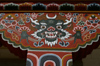 Bhutan - Thimphu - horned demon - painting on support column - city center - photo by A.Ferrari