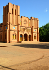 Ouagadougou, Burkina Faso: faade of the Catholic Cathedral of the Immaculate Conception of Ouagadougou - built in mudbrick, with two steeples of different heights, neo romanesque style - built by Monseigneur Joanny Thvenoud of the White Fathers - photo by M.Torres