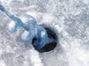 Northwest Territories, Canada: ice fishing - ice auger - hole drilled in the ice - photo by Air West Coast