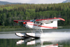 Skitine river, BC, Canada: seaplane - Cessna 185 Skywagon II, powered by a six cylinder 280 hp IO-550 engine from Teledyne Continental Motors - C-GORH - photo by R.Eime