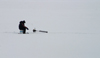 Canada / Kanada - Saskatchewan: Canadian man fishing in the ice - photo by M.Duffy