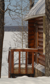 Canada / Kanada - Saskatchewan: winter scene - snowy view from log cabin door in scenic Northern Canada - photo by M.Duffy