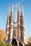 Catalonia - Barcelona: the Sacred Family Cathedral - always escorted by a crane / Sagrada Familia - Temple Expiatori de la Sagrada Famlia - the Passion faade - photo by Miguel Torres
