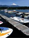 Araucana Region, Chile - Pucn: Lake Villarica - boats in the marina and view of Villarica volcano - photo by Y.Baby