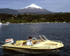 Araucana Region, Chile - Pucn: Lake Villarica - small boat and view of Villarica volcano - photo by Y.Baby