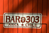 Chile - Arica: bar door painted as car license plate - puerta de un bar - photo by D.Smith