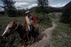 Torres del Paine National Park, Magallanes region, Chile: gaucho on horse on the W trail - Chilean Patagonia - photo by C.Lovell