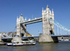 London: Tower bridge and tour boat - Thames river - photo by K.White