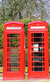 Warrington, Cheshire, England, UK: twin Telephone Boxes, Sankey Street - public phones - phone booths - quintessential British red phone box, designed by Sir Giles Gilbert Scott, English architect - K6 - photo by D.Jackson
