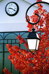 La Varenne, Val-de-Marne, Ile-de-France: clock, lamp and red leaves - photo by Y.Baby