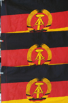 Germany - Berlin: flags of the former GDR are sold as souveniers by traders at Checkpoint Charlie - nostalgia - photo by W.Schmidt