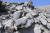 Greece, Cyclades, Santorini: black volcanic rocks on the islet of Megali Kameni - photo by P.Hellander