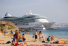 Greek islands - Mykonos (Hora)/ Mikonos / JMK: Agios Stefanos: beach and Cruise ship at Mykonos post - Brilliance of the Seas - photo by David Smith