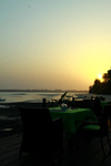 Rubane Island, Bijags Archipelago - UNESCO biosphere reserve, Bubaque sector, Bolama region, Guinea Bissau / Guin Bissau: Sunset, view of beach, palm trees, beachfront restaurant at Hotel Punta Anchaca / pr-do-sol, paisagem da praia, palmeiras, esplanada do Hotel Punta Anchaca- photo by R.V.Lopes