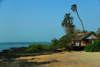 Rubane Island, Bijags Archipelago - UNESCO biosphere reserve, Bubaque sector, Bolama region, Guinea Bissau / Guin Bissau: beach view, bungalow at Hotel Punta Anchaca, palms, rocks / Paisagem da praia, palmeiras, barcos, rochas, bungalow Hotel Punta Anchaca - photo by R.V.Lopes