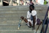 India - Haridwar (Uttaranchal state): beggar relies on the charity of holy pilgrims visiting for the Bhagirath prayer - amputee (photo by Rod Eime)