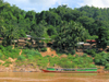 Laos - Mekong River: transportation - long boat - photo by M.Samper