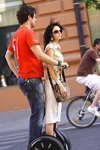 Lithuania - Vilnius: couple on a Segway - popular transport - Gediminas' avenue - photo by Sandia