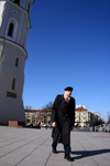 Lithuania - Vilnius: Cathedral square - man going to Sunday Mass - photo by Sandia