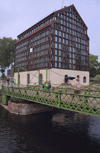 Klaipeda, Lithuania: rotating bridge and an old warehouse that became an hotel - marina area - photo by A.Dnieprowsky