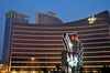 Macau, China: Wynn Macau luxury hotel and casino resort - sign at dusk - Cidade de Sintra Street - photo by M.Torres