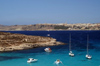 Malta - Comino: blue lagoon and Mgarr in the background (photo by A.Ferrari)