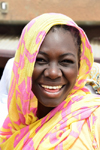 Nouakchott, Mauritania: smiling face of Mauritanian african woman with yellow head-scarf - photo by M.Torres