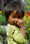 Nepal - Langtang region - poor child wipes his nose with fingers - photo by E.Petitalot