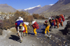 Upper Mustang district, Annapurna area, Dhawalagiri Zone, Nepal: sherpas cross a stream - photo by W.Allgwer