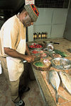 Rodrigues island: Ton Roland preparing  delicious Rodriguan food (photo by Gilbert Soobraydoo)