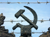 Russia - Udmurtia - Izhevsk: barbed-wire and a hammer and sickle - communist symbols - photo by P.Artus
