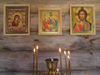 Russia - Solovetsky Islands: inside an Orthodox chappel - icons and candles - photo by J.Kaman