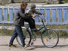 Russia - Solovetsky Islands: help - boy learning to ride a bike - photo by J.Kaman
