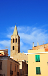 Alghero / L'Alguer, Sassari province, Sardinia / Sardegna / Sardigna: the tower of the Cathedral of Santa Maria rises above the houses of the historical centre - photo by M.Torres