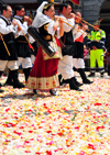 Cagliari, Sardinia / Sardegna / Sardigna: Feast of Sant'Efisio / Sagra di Sant'Efisio - pipers walk over rose petals playing launeddas - triplepipe - typical Sardinian woodwind instrument - paving stones covered in flowers of Via Roma - infiorata - photo by M.Torres