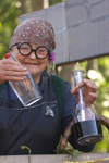 Slovenia - Lipica / Lipizza - Goriska region: Lipica stud farm - Craft fair during an special open day - woman putting on a winemaking show - photo by I.Middleton