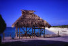 Providenciales - Turks and Caicos: beach hut and blue sea - photo by L.Bo