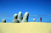 Uruguay - Punta del Este: the town's most famous landmark - hand in the sand sculpture, by Mario Irarrazabal - La Brava beach - photo by S.Dona'