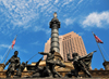 Cleveland, Ohio, USA: Public Square - Soldiers' and Sailors' Monument - honors servicemen from Cuyahoga County in the Civil War Yankee forces - Advance Guard Grouping - sculptures and design by architect Levi T. Scofield - in the background 200 Public Square tower - photo by M.Torres