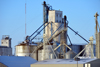 Etter, Moore County, Texas, USA: aged grain processing facility on the BNSF railway line - grain bins by the U.S. Highway 287, Texas Panhandle - DeBruce grain and Dumas co-op - photo by M.Torres