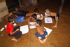 Skandis, Lubok Antu District, Sarawak, Borneo, Malaysia: drawing sessions for the kids of the Iban longhouse - Dayaks - photo by A.Ferrari